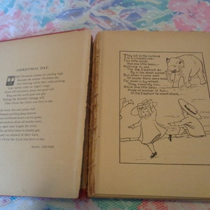 May include: Open vintage book with red cover. The left page features the poem "Christmas Day" by Susan Coolidge. The right page has an illustration of an elephant and children with a poem. The book's pages are aged.