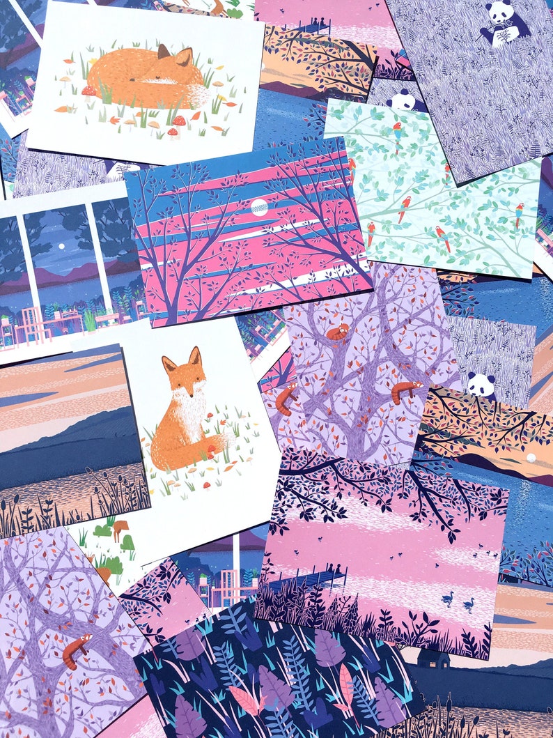 May include: A collection of colorful illustrated postcards featuring various nature scenes, including foxes, birds, and trees. The postcards are arranged in a random pattern, creating a visually appealing and whimsical display.