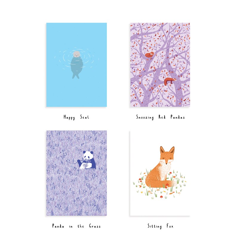 May include: Four illustrated cards with different animals. The first card shows a blue seal swimming in blue water. The second card shows two red pandas sleeping in a tree with purple leaves. The third card shows a panda sitting in a field of purple grass. The fourth card shows a fox sitting in a field of orange and yellow leaves.