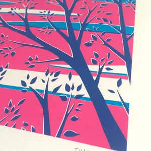 May include: A vibrant print featuring stylized trees with blue trunks and leaves against a pink and striped background. The artwork includes the artist's signature, "T. Hardwick," in the lower right corner. The color palette includes pink, blue, and white.