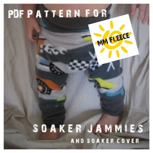May include: PDF pattern for soaker jammies and soaker cover, made with MM Fleece. The pattern shows a baby wearing grey fleece pants with a colorful car print.