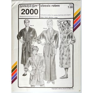 May include: A vintage sewing pattern for classic robes, featuring illustrations of different robe styles. The pattern is labeled "2000" and includes instructions for sewing machines and sergers. Sizes include small, medium, and large.