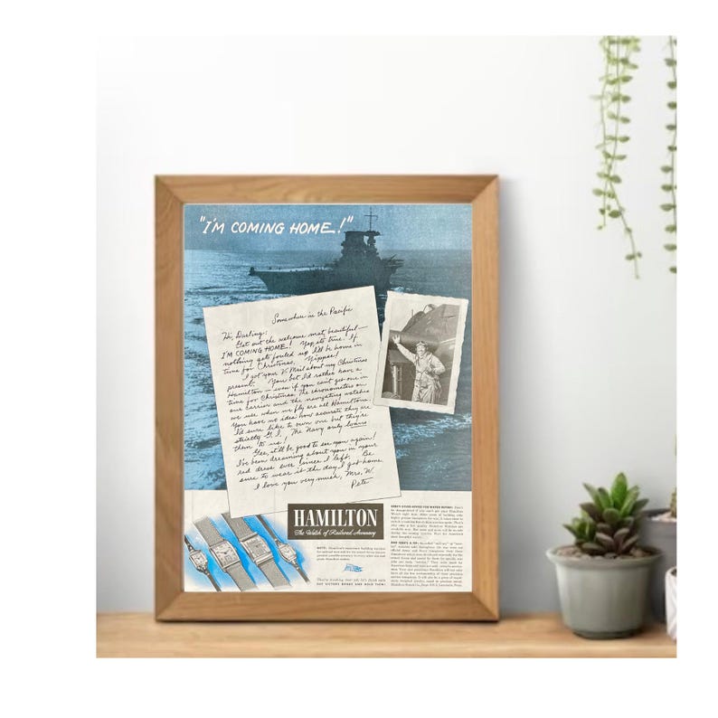 May include: A vintage advertisement for Hamilton watches featuring a handwritten letter from a soldier in the Pacific. The letter reads "I'm coming home!" and is accompanied by a photo of the soldier in uniform. The ad also features a photo of a ship and three Hamilton watches.
