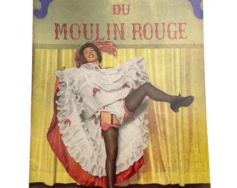 May include: Vintage postcard featuring a dancer in a white ruffled dress with red accents, black stockings, and a garter. The text "BAL DU MOULIN ROUGE" is displayed above the dancer. The background is a yellow curtain.