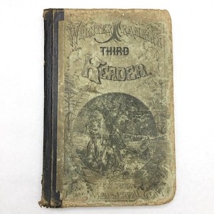 May include: A white ceramic mug with a black handle and the text "But First, Coffee" in a black, bold font. The mug is on a white surface.