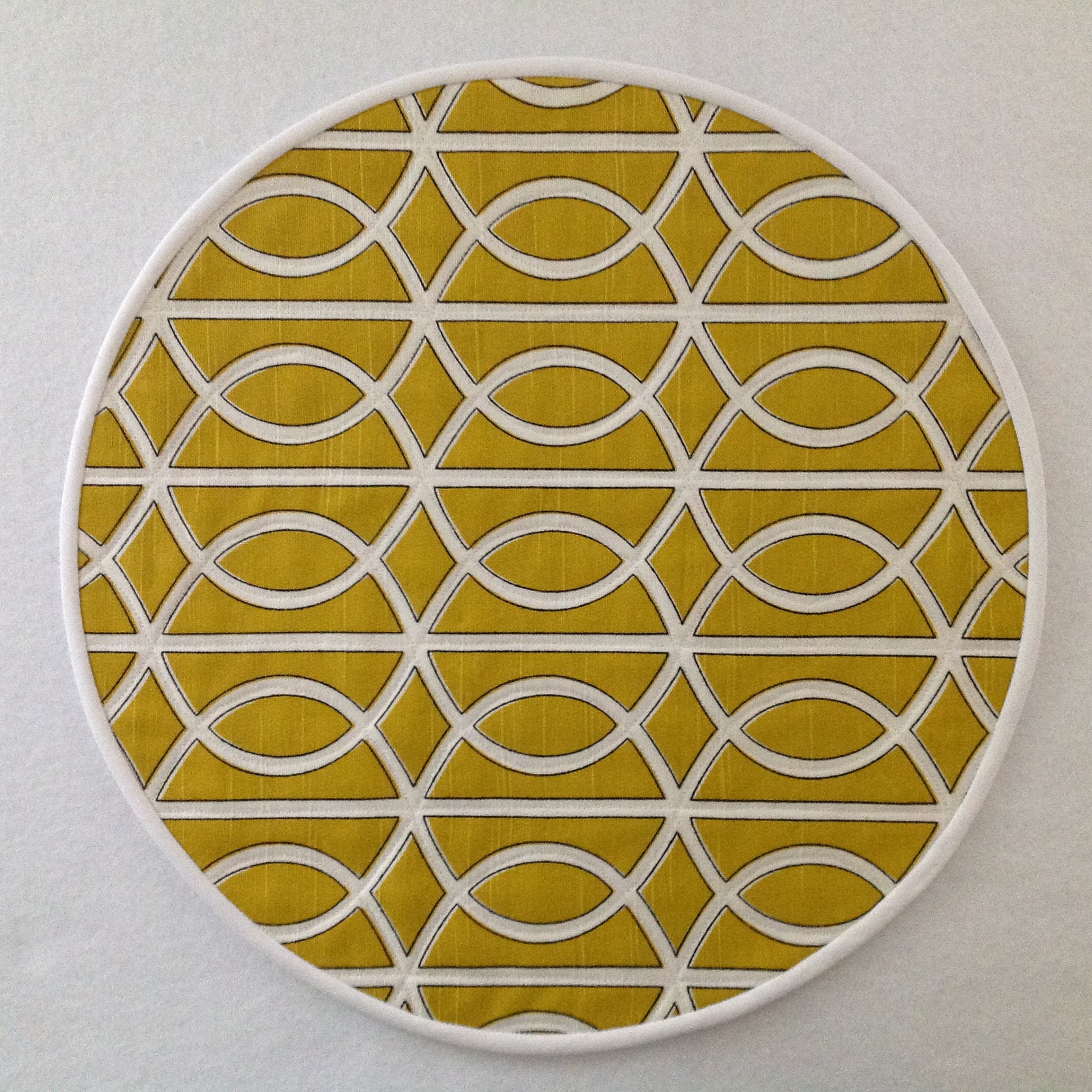 Bold Mustard yellow quilted geometric round placemats.