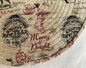 North Pole Postage Stamp Print Fabric in a Quilted Round Placemat, Sold in Sets of 2