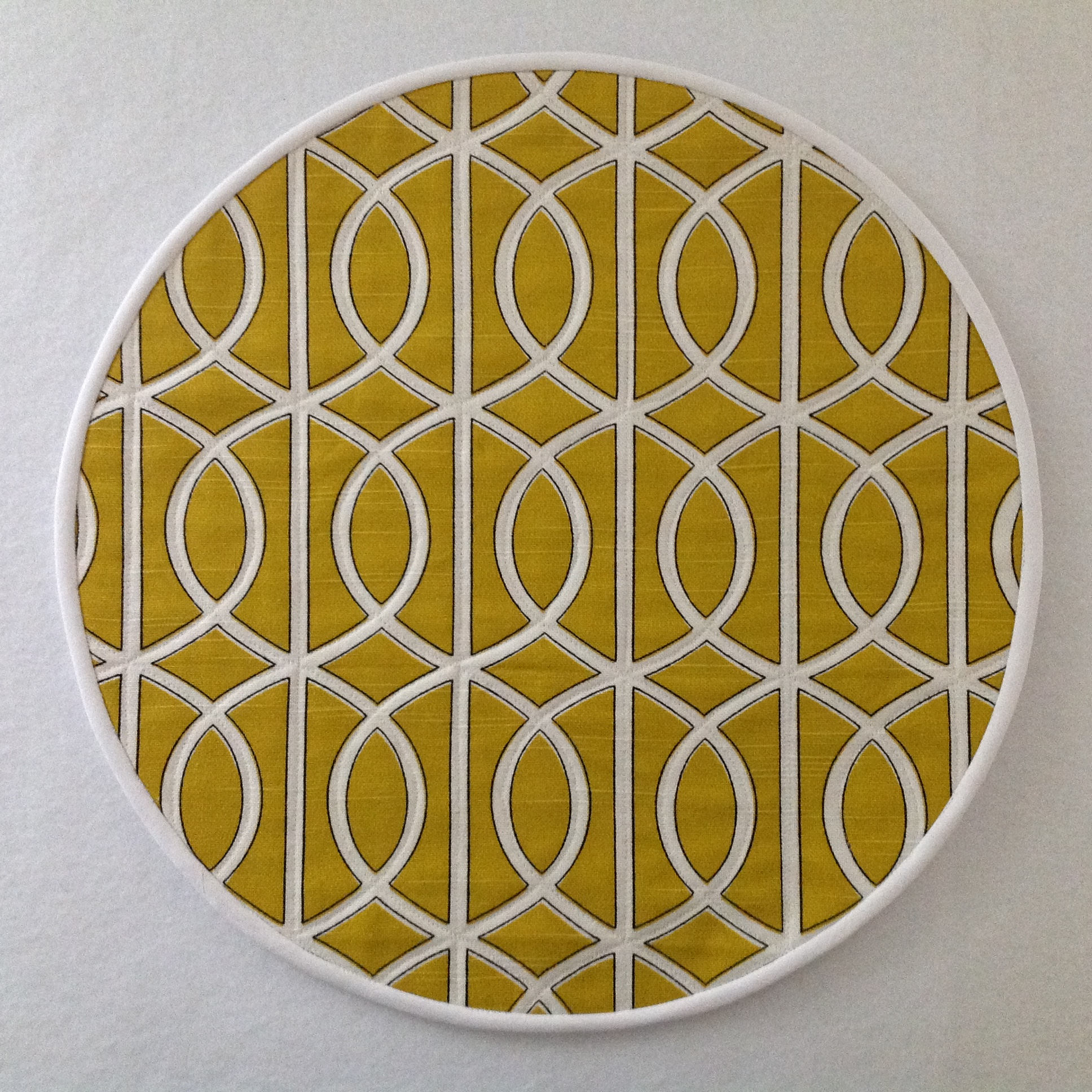 Bold Mustard yellow quilted geometric round placemats.