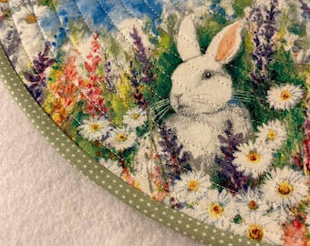 Easter Bunnies in the flower garden  , round placemat.