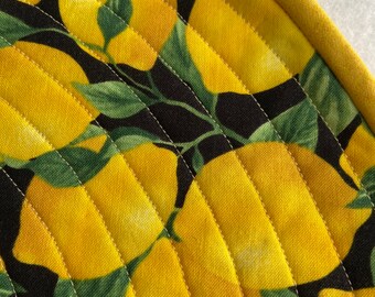 Lemons on Black Round Quilted Placemats sold in sets of two.