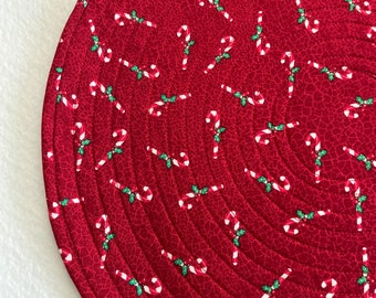 Christmas Candy Canes on Red Quilted Round Placemats