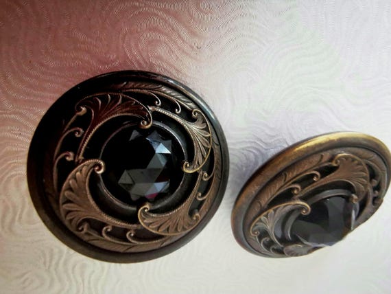 Rare! Two Antique Art Nouveau Egyptian Revival Buttons with French Jet Black Multi Faceted Cabochon Centre and Ornate Brass Openwork.