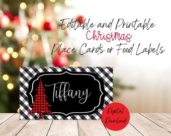 May include: A Christmas place card or food label with a black and white checkered pattern. The card features a black center with the name "Tiffany" in white script and a red plaid Christmas tree. The words "Editable and Printable Christmas Place Cards or Food Labels" are written above the card.