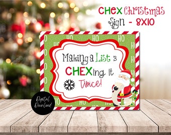 Puede incluir: Un letrero navideño rectangular con fondo verde y borde rojo y blanco. El letrero dice "Making a List & CHEXing it Twice!" con una ilustración de Papá Noel. El letrero mide 20,3 x 25,4 cm.