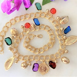 Charm Necklace with Open Bezel Gemstones , Engraved Puff Flower Charms, Leaf Charms and Coin Charms on Gold Tone Parallel Curb Chain