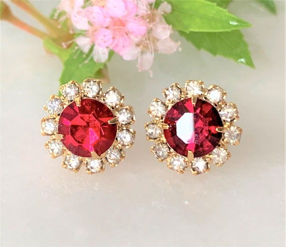 Faceted Ruby Stud Pierced Earrings Embraced With Faceted Crystal