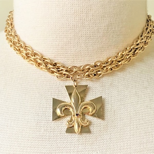 Hammered Maltese Cross Fleur De Lis Gold Tone Pendant Necklace Prong Set with Ruby or Sapphire Crystal Stone on Endless Textured Rope Chain