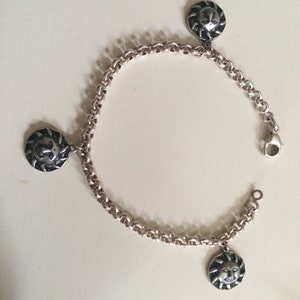 Silver bracelet with sun charms