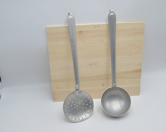 Pair of aluminum kitchen utensils from the 1940s