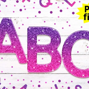 Puede incluir: Tres letras de purpurina rosa y morada que deletrean "ABC" sobre un fondo de madera blanca con confeti rosa y morado.