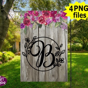 May include: A wooden garden flag with a floral design and a black letter "B" in a circle. The flag is on a wooden pole.