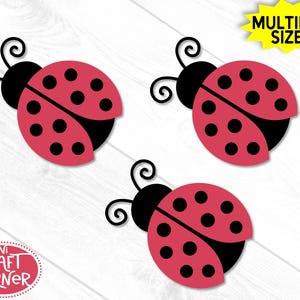 May include: Three red ladybug cutouts with black spots and antennae are displayed against a white wood grain background. The ladybugs have black heads and wings. The text "MULTIPLE SIZES!" is in a yellow starburst. The text "MINI CRAFT CORNER" is in a red circle.