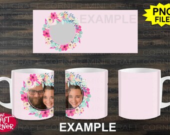 May include: A white ceramic mug with a pink background and a floral design. The design features a wreath of pink, blue, and green flowers with a couple's photo in the center. The mug is 11 ounces.