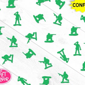 May include: Green plastic toy soldier confetti scattered on a white wooden surface. The confetti includes various poses of soldiers, some aiming rifles, others saluting. The word "Confetti" is in a yellow starburst, and the Mini Craft Corner logo is in the lower left.