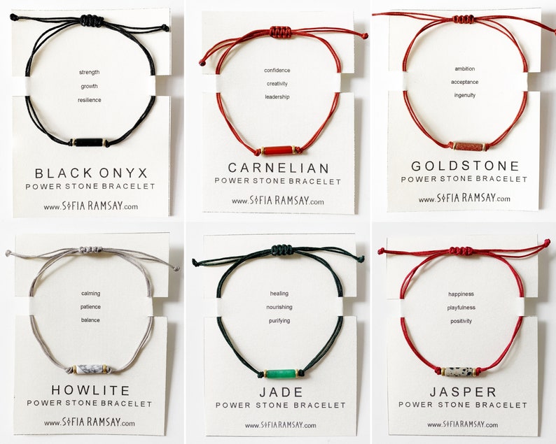 May include: Six different coloured string bracelets with a small stone bead in the centre. Each bracelet is labelled with the name of the stone and a list of its associated qualities. The stones are Black Onyx, Carnelian, Goldstone, Howlite, Jade, and Jasper.
