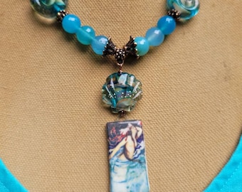 Artisan Mermaid Necklace Set, lampwork glass, aquamarine quartz, bronze sealife findings, and English stoneware Mermaid image.