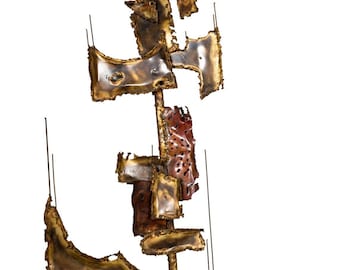 May include: Abstract metal wall sculpture with a gold and brown finish. The sculpture is made of multiple pieces of metal that are welded together to create a unique and interesting design.