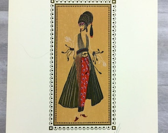 May include: A vintage art print featuring a woman in a green and red dress with a black hat and sunglasses. The print is framed with a gold border and has a white background.