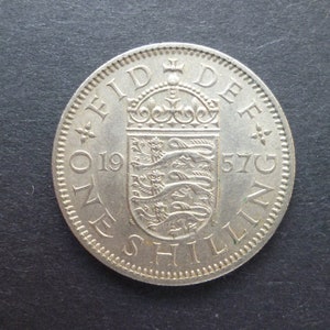 United Kingdom 1957 Shilling coin (English Version) ideal gift or for craft or jewellery making in good used (circulated) condition.