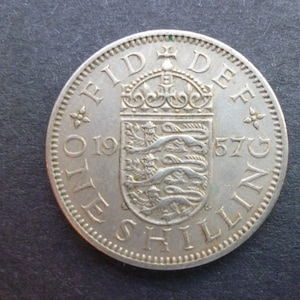 United Kingdom 1957 Shilling coin (English Version) ideal gift or for craft or jewellery making in good used (circulated) condition.