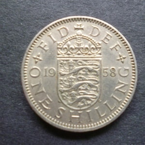 United Kingdom 1958 Shilling coin (English Version) ideal gift or for craft or jewellery making in good used (circulated) condition.