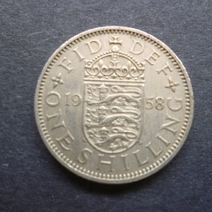 United Kingdom 1958 Shilling coin (English Version) ideal gift or for craft or jewellery making in good used (circulated) condition.
