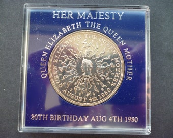 in good condition housed in a near scratch free rigid plastic case. 1980 Crown coin The 80th Birthday of Queen Elizabeth The Queen Mother