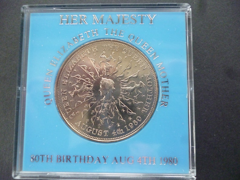 in good condition housed in a near scratch free rigid plastic case. 1980 Crown coin The 80th Birthday of Queen Elizabeth The Queen Mother