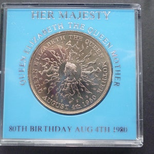 1980 Crown coin, The 80th Birthday of Queen Elizabeth The Queen Mother, in good condition housed in a near scratch free rigid plastic case.