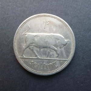 Vintage Irish 1964 Eire (Ireland Republic) Shilling coin featuring a Bull and a Harp, ideal for craft or jewellery making.