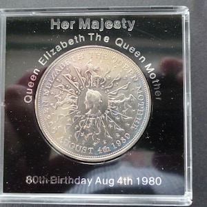 1980 Crown coin, The 80th Birthday of Queen Elizabeth The Queen Mother, in good condition housed in a near scratch free rigid plastic case.
