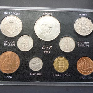 Vintage set of Great Britain 1965 Coins consisting of 9 different circulated (used) coins housed in a rigid plastic case. 1965 English coins