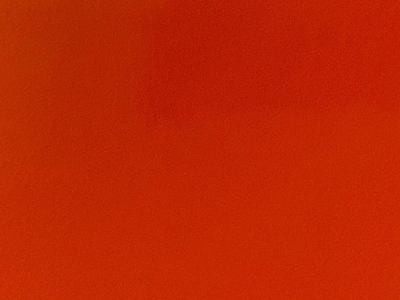 Może przedstawiać: Jednolite pomarańczowe tło o lekko fakturowanej powierzchni.