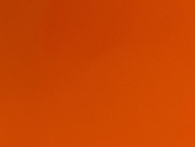 May include: Solid orange background.