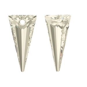 May include: Two clear crystal pendants in the shape of a pointed cone with a hole at the top for hanging.