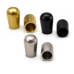 Raw brass, light antique silver and black painted metal end caps for 9mm leather cord on white background