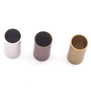 May include: Three empty metal tubes, one silver, one copper, and one gold.