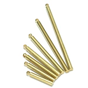May include: A set of six gold-colored metal rods with rounded ends. The rods are arranged in a fan shape, with the longest rod at the top and the shortest rod at the bottom.