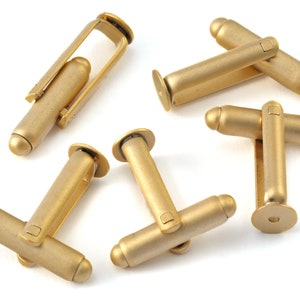 May include: Five gold-toned cufflinks with a polished finish. Each cufflink has a round top and a square base.