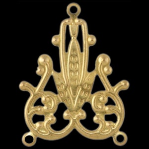May include: Gold-toned metal pendant with a decorative design featuring a stylized wheat stalk and intricate scrollwork. The pendant has three jump rings for attaching to a chain or cord.